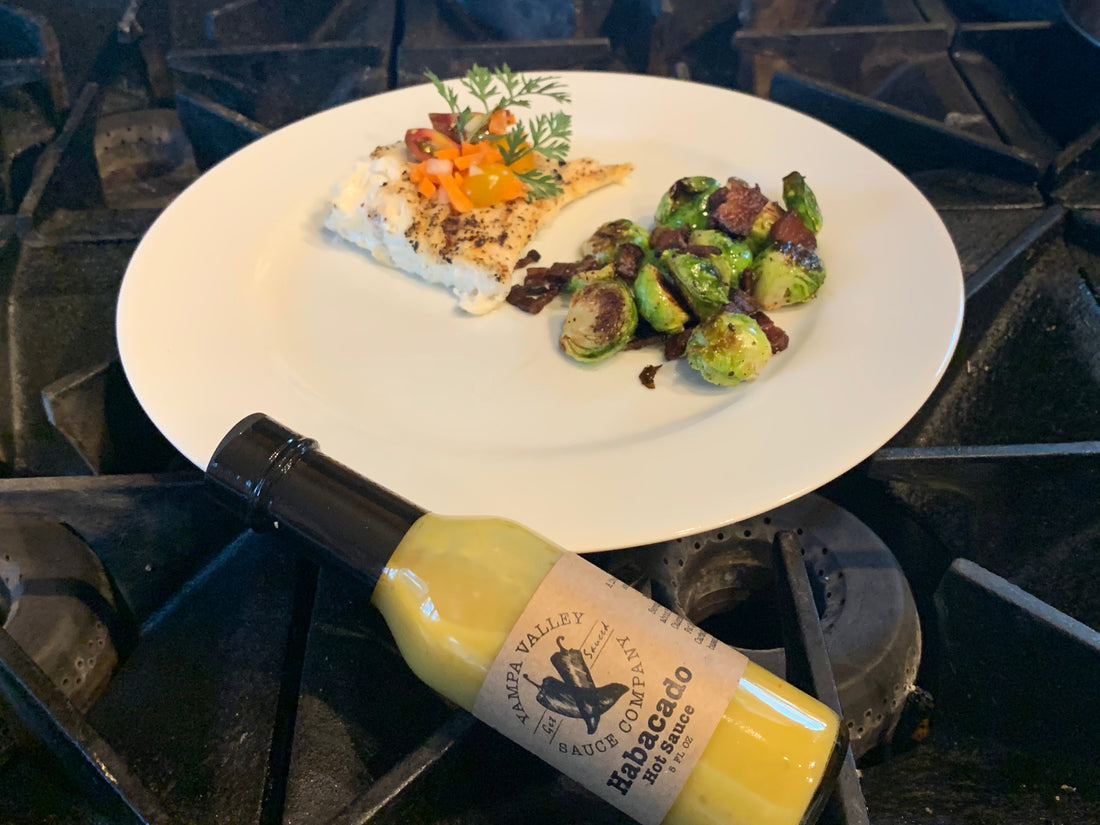 Pan Fried Mahi Mahi  Topped with Pickled  Carrots, served with Honey Glazed Brussel Sprouts and Bacon